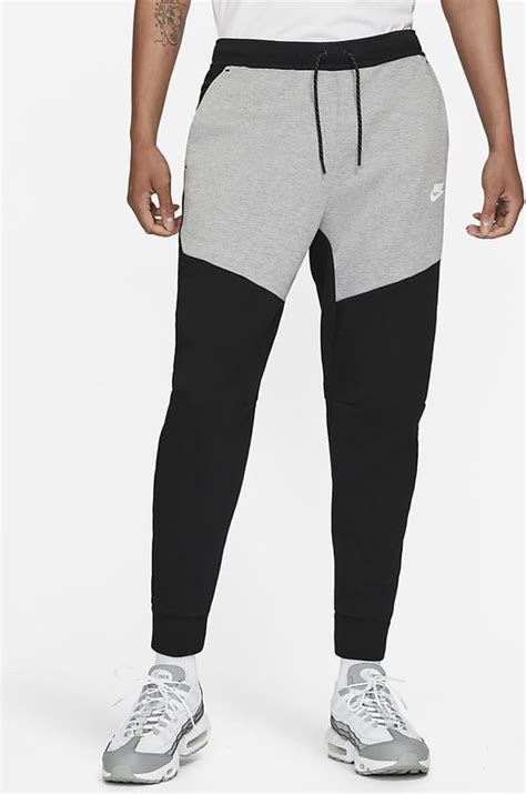 donkerblauwe nike tech broek|fleece nike tech heren.